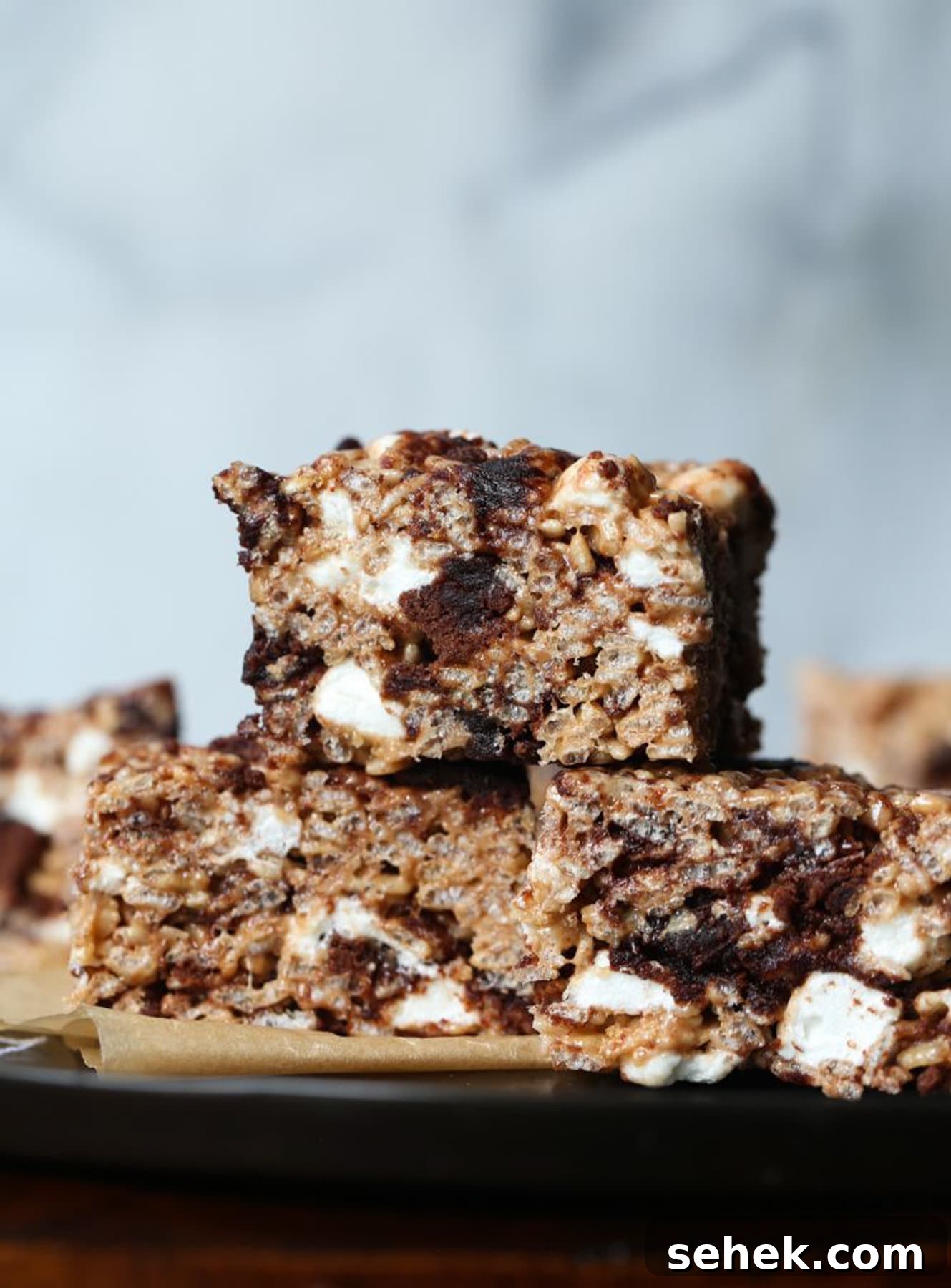 Brownie Batter Krispie Treats Brownie Krispie Treats stacked on top of each other