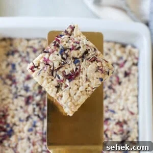 one rice Krispie treat with red, white and blue cornflowers