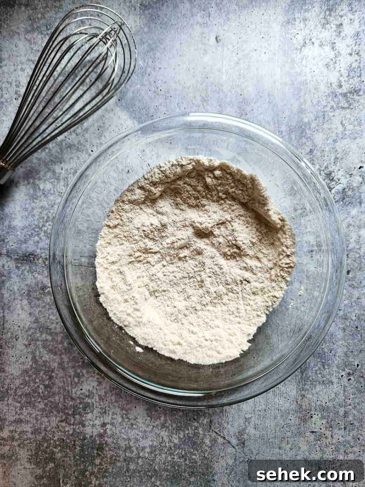 Spiced Eggnog Waffles with Warm Holiday Flavors 4 Dry ingredients in a bowl for eggnog waffles.