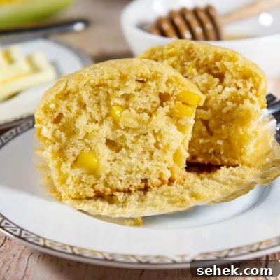 One cornbread muffin cut open