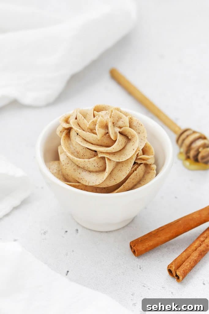 Whipped Honey Butter with Cinnamon — Fluffy Spread Recipe 11 Whipped Cinnamon Butter Piped into a small white bowl in a pretty design