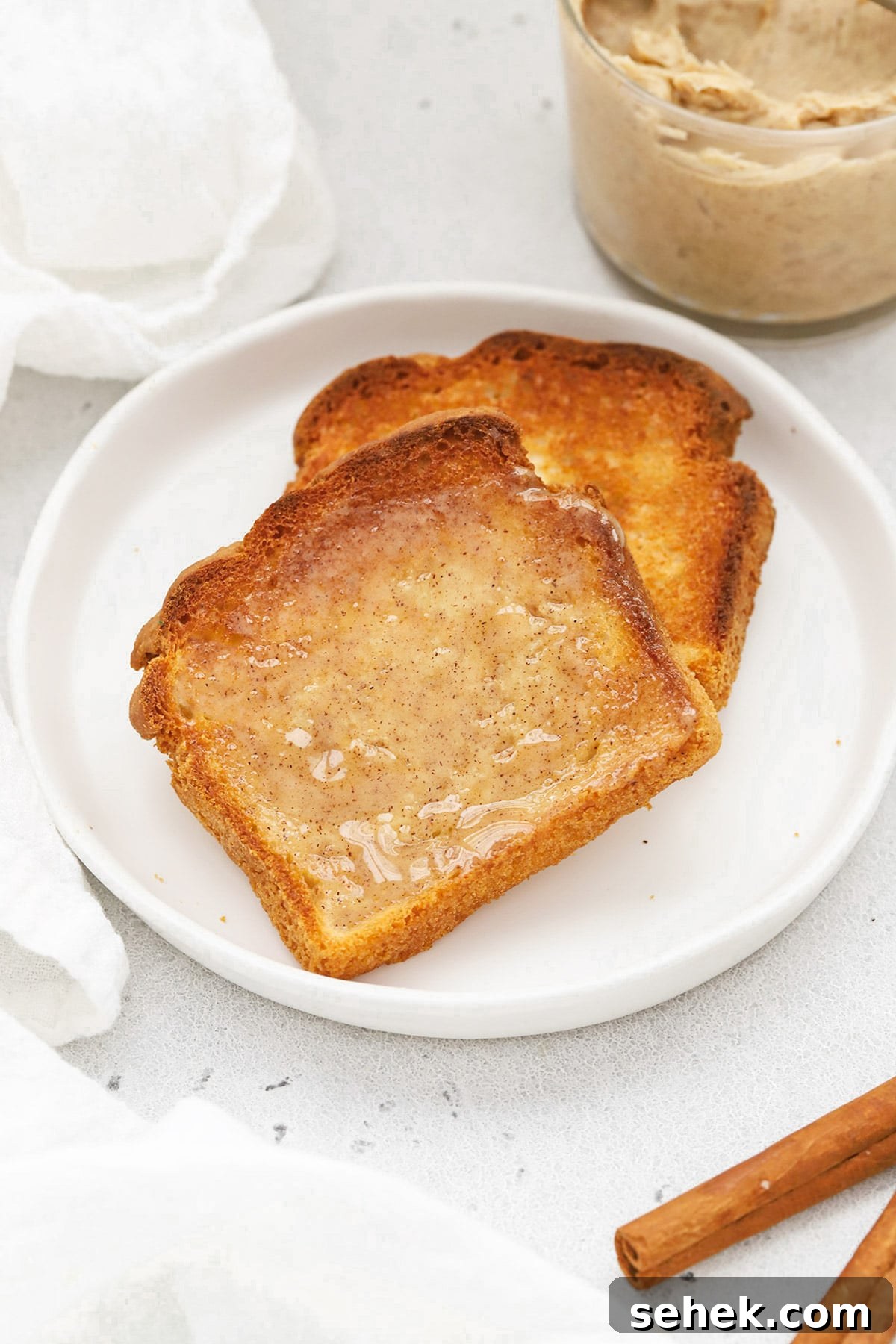 Whipped Honey Butter with Cinnamon — Fluffy Spread Recipe 13 Front view of two slices of gluten-free toast topped with whipped cinnamon butter