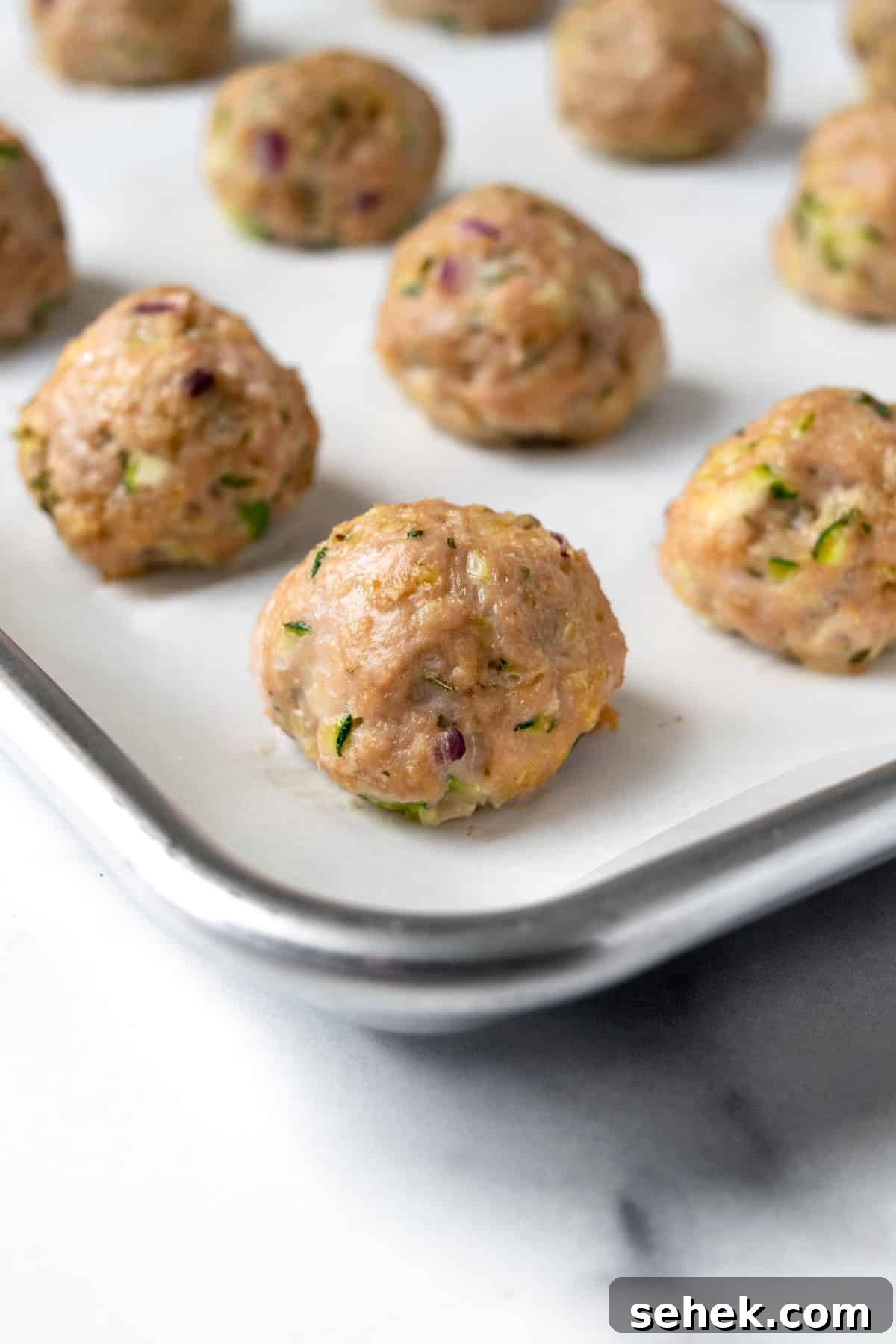 Baked Zucchini Turkey Meatballs on Baking Sheet.