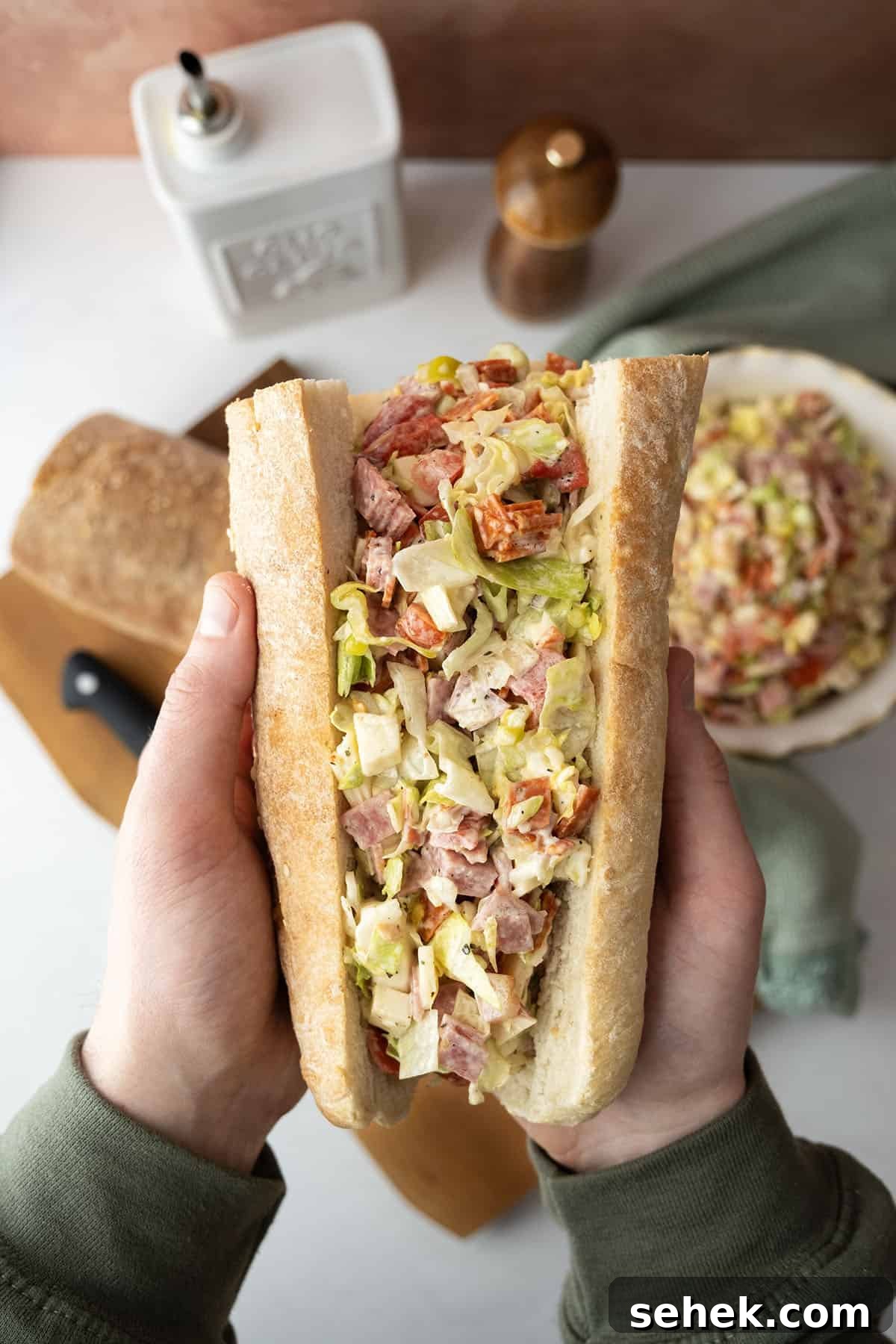 Classic Italian Chopped Sandwich Recipe for a Flavorful Sub 2 Chopped Italian Salad in an Italian sub.