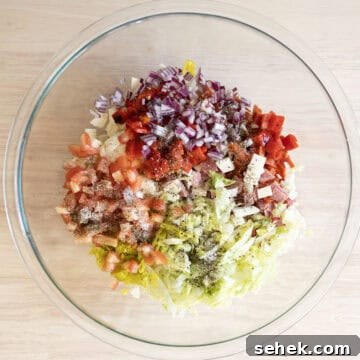 Classic Italian Chopped Sandwich Recipe for a Flavorful Sub 4 Combined vegetables and meat for the salad.