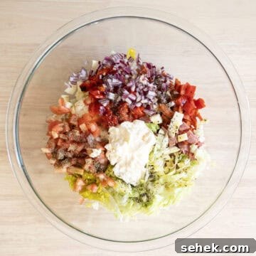 Classic Italian Chopped Sandwich Recipe for a Flavorful Sub 5 Combined ingredients with mayo, olive oil, seasoning, and vinegar.