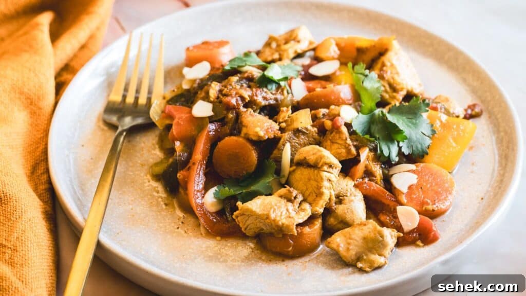 15 Quick Weeknight Dinners to Save You Time and Stress 15 Instant Pot chicken with sweet peppers, carrots, herbs, and tomatoes on a white plate.