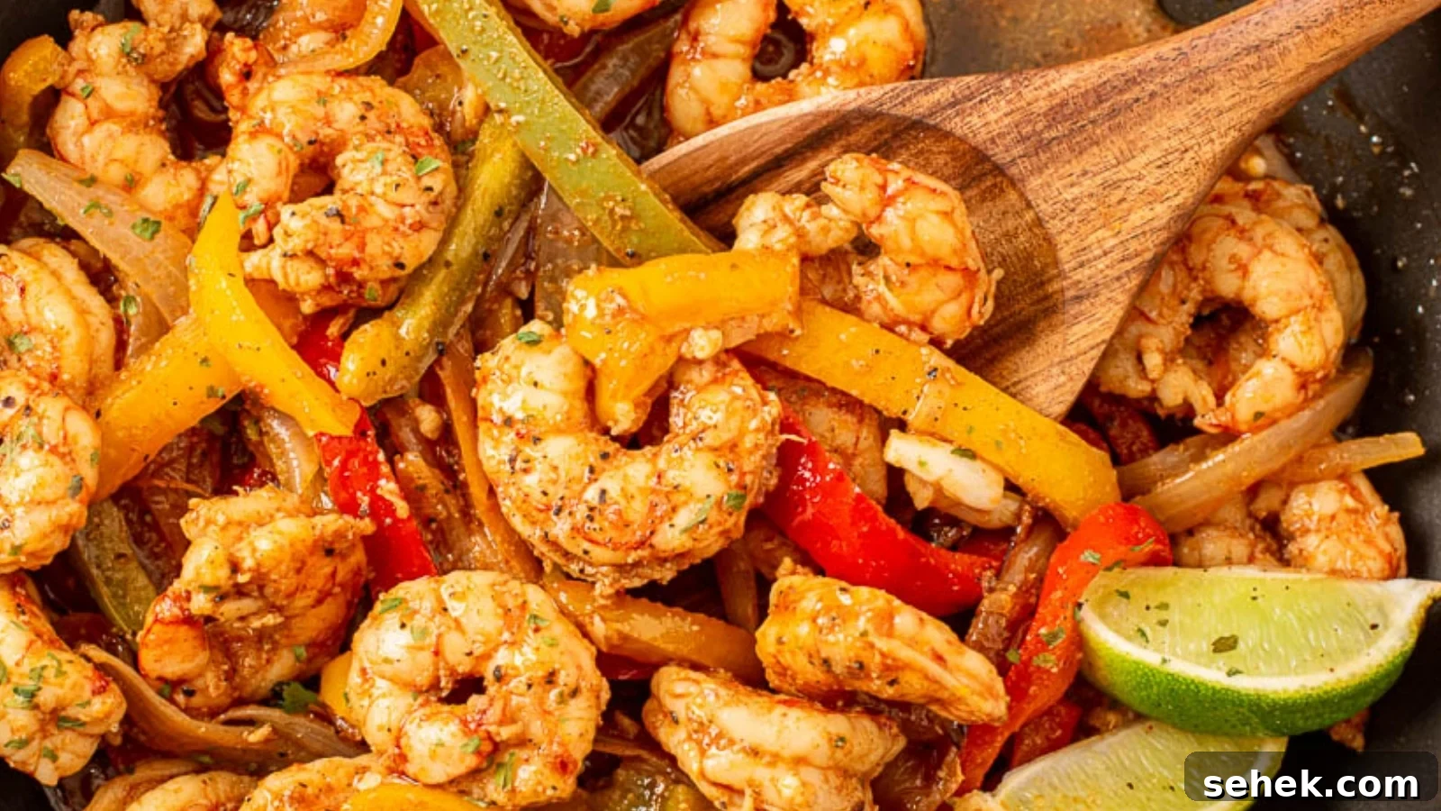 15 Quick Weeknight Dinners to Save You Time and Stress 17 Shrimp and peppers in a skillet with serving spoon.