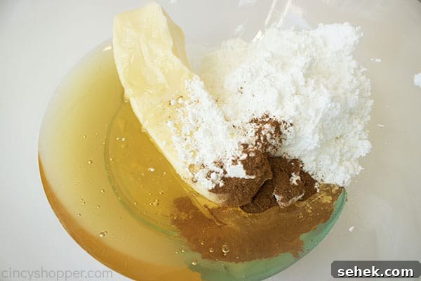Homemade Cinnamon Butter Recipe for Toasts and Pastries 8 All ingredients in a clear bowl with a white background