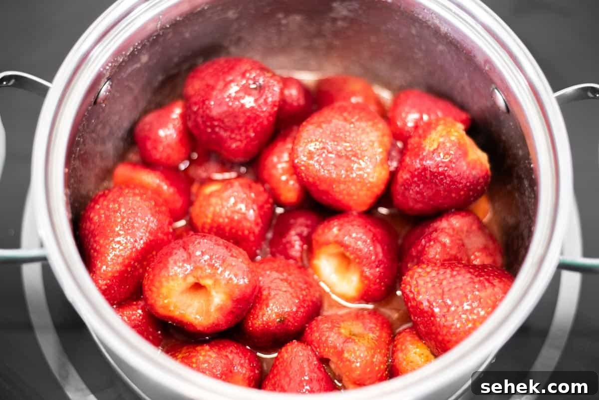 Low-Sugar Strawberry Jam Recipe — Small-Batch Preserving Tips 4 Strawberries with sugar, lemon juice and salt in pot.