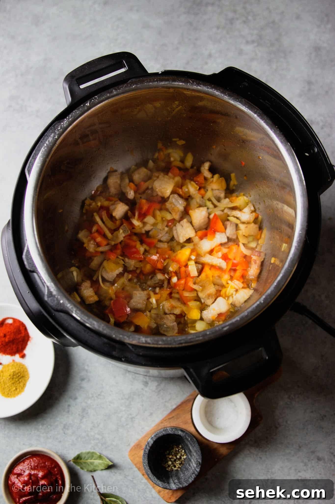 Instant Pot Brazilian Feijoada-Inspired Black Bean Soup 5 sauteeing vegetables in an instant pot.