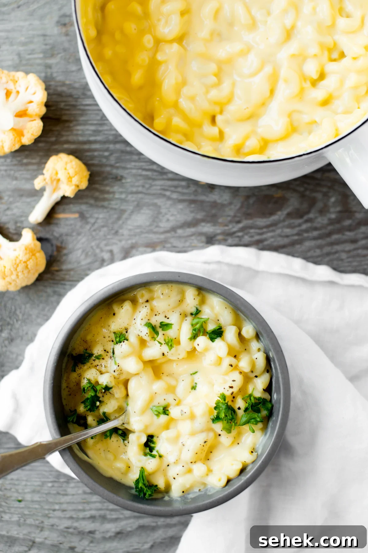 Creamy Stovetop Cauliflower Mac and Cheese Recipe 2 closeup of bowl of cauliflower mac and cheese with parsley