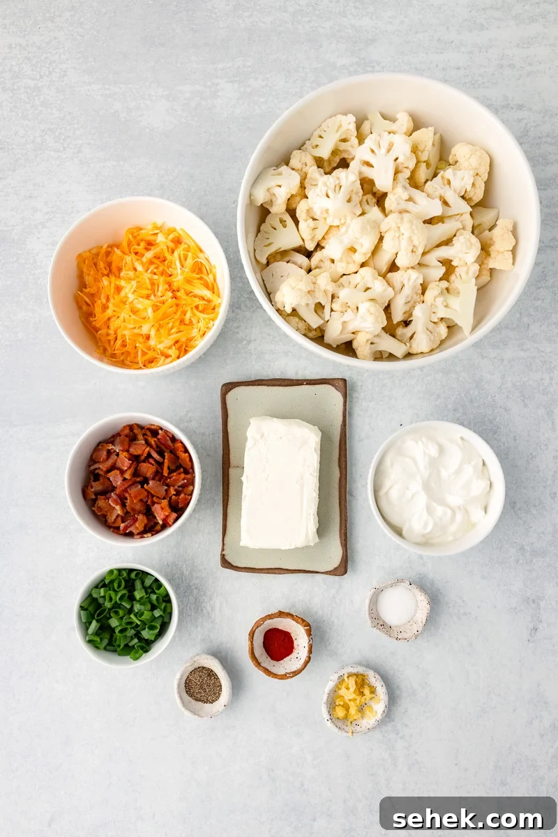 Creamy Loaded Cauliflower Casserole with Bacon and Cheddar 5 Ingredients for cauliflower casserole in small glass bowl.