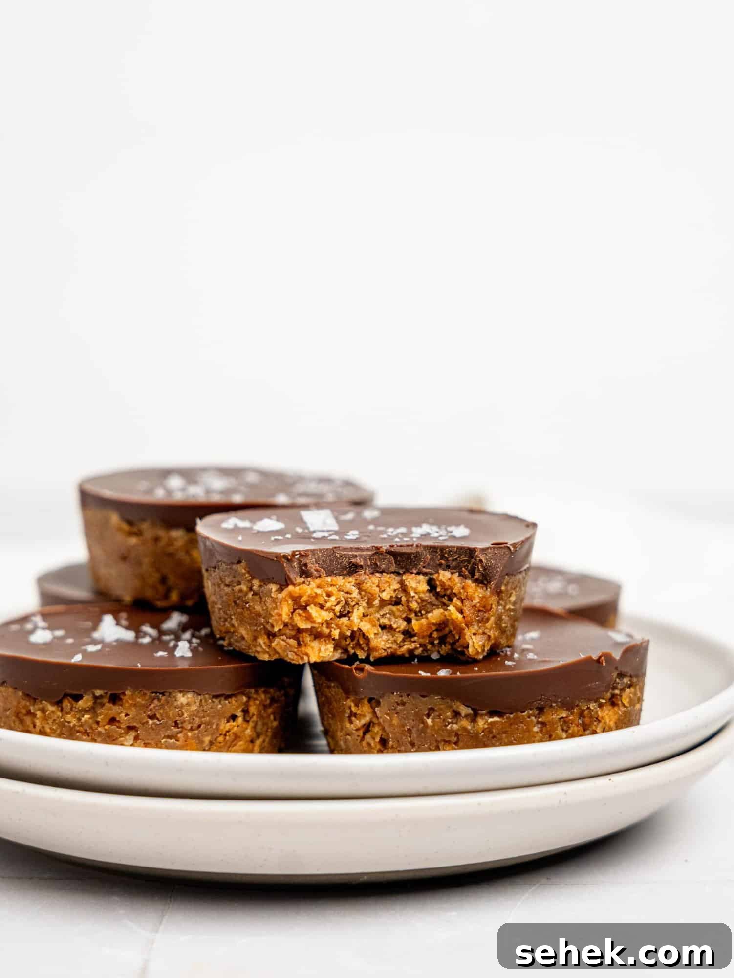 Peanut Butter Weetbix Cups on a white plate.
