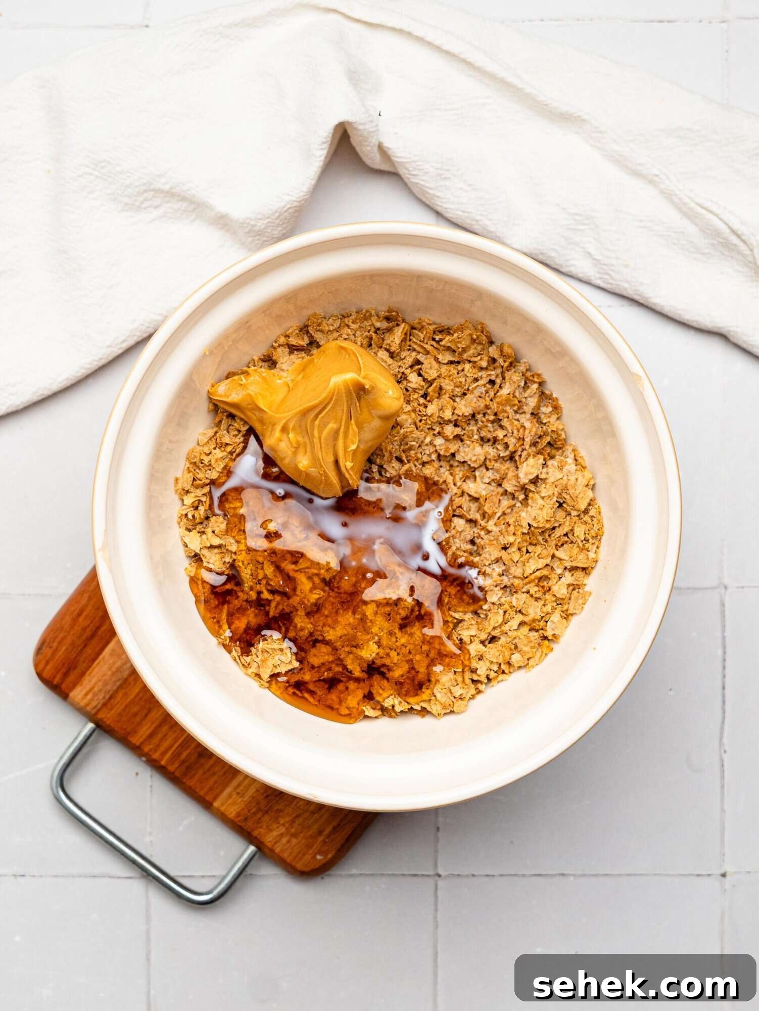 Peanut BUtter Weetabix cups base ingredients in a mixing bowl.