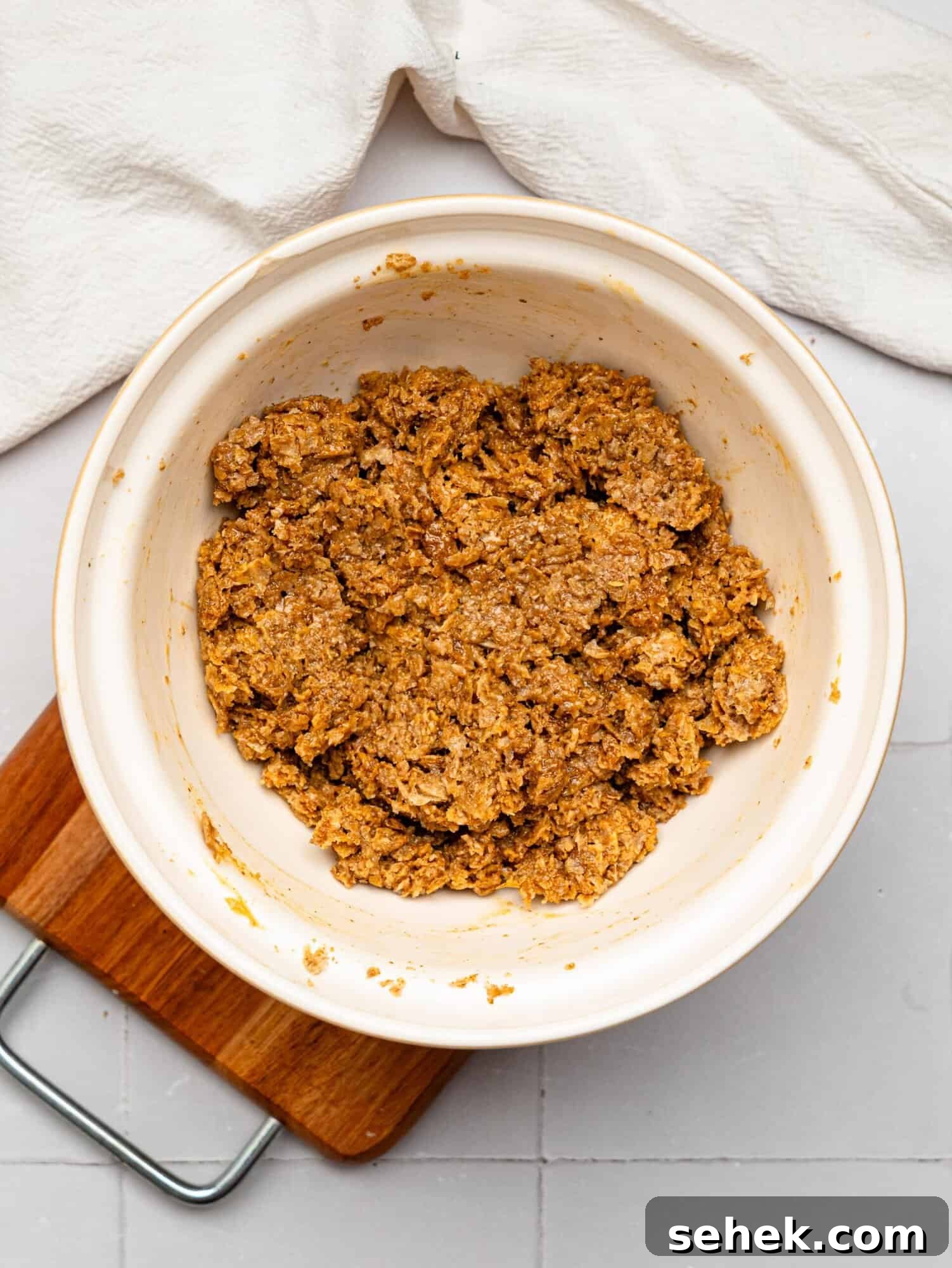 Peanut BUtter Weetabix cups base mixture in a mixing bowl.