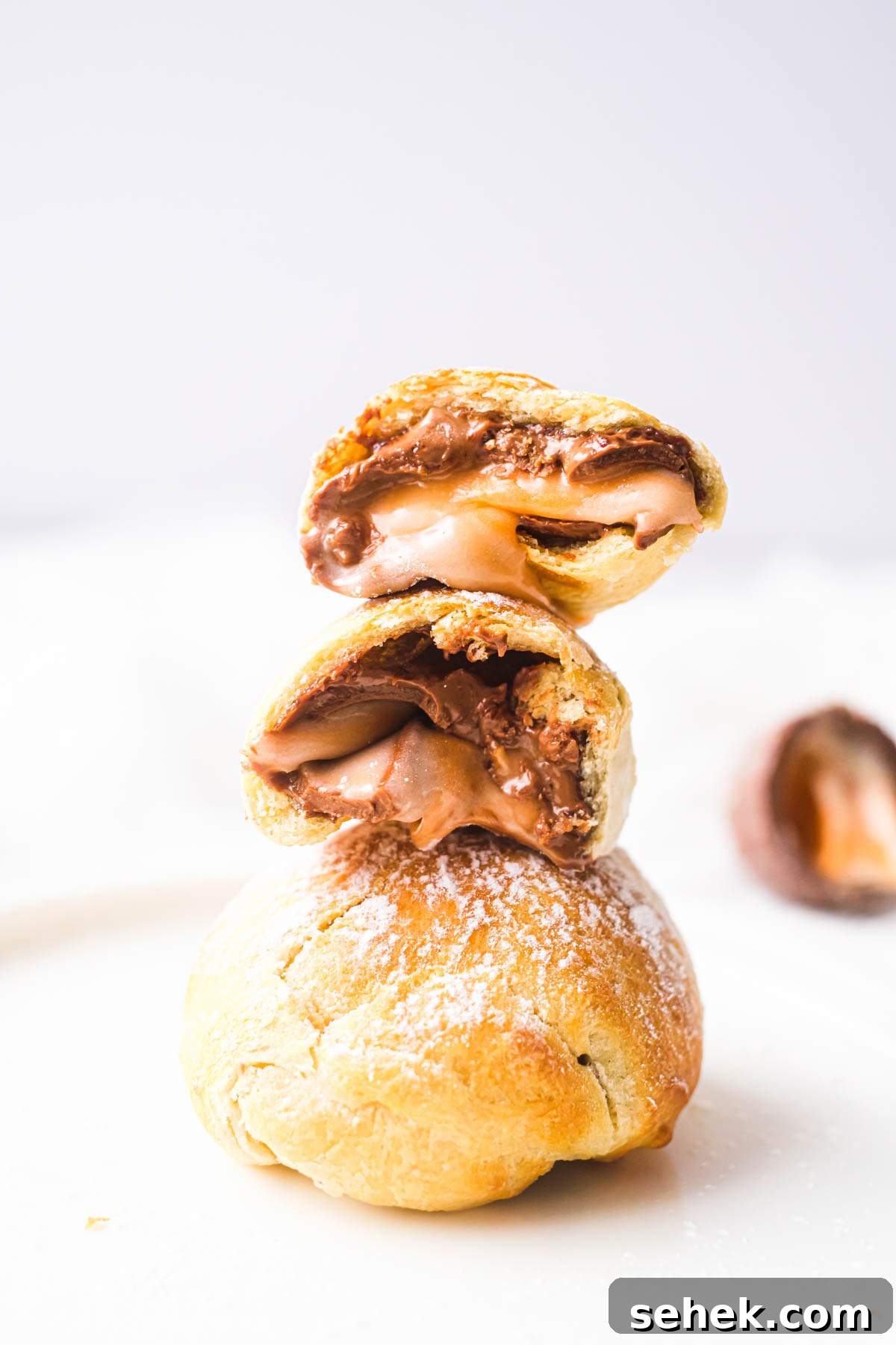 Air-Fried Cadbury Creme Egg Dessert Recipe 2 air fryer fried creme eggs stacked vertically
