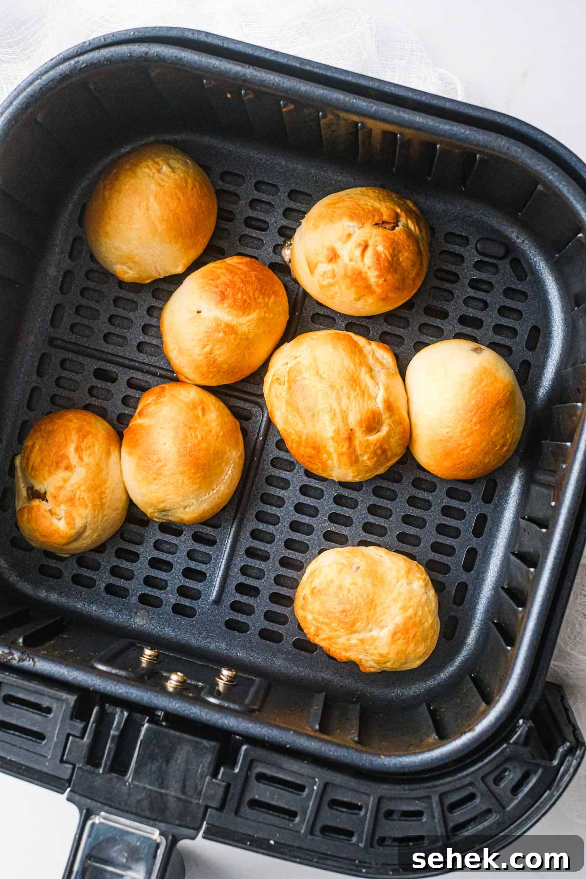 Air-Fried Cadbury Creme Egg Dessert Recipe 7 top down view of the cooked air fryer fried creme egg recipe inside the air fryer basket