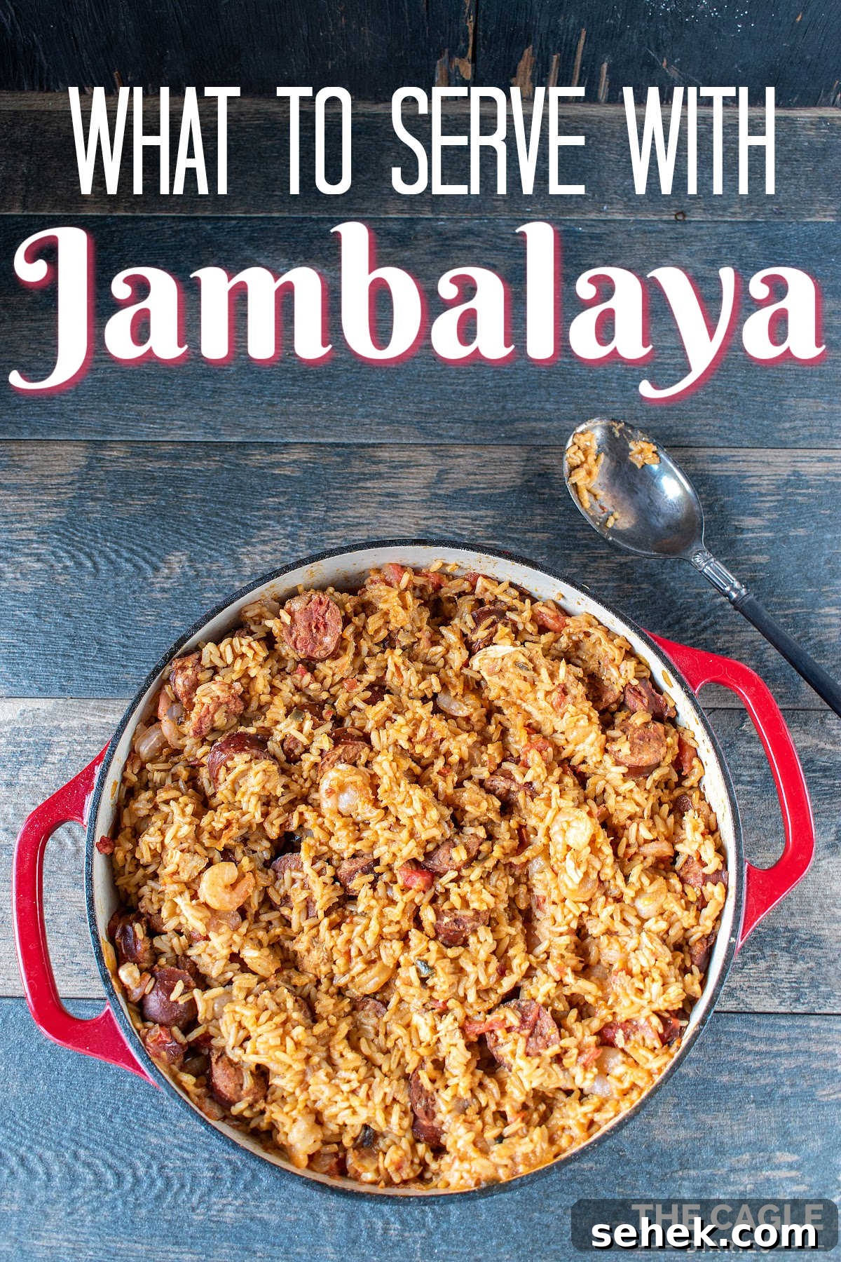 28 Delicious Sides to Serve with Jambalaya 2 A wooden table with a red pot filled with Jambalaya with text overlay saying what to serve with Jambalaya.