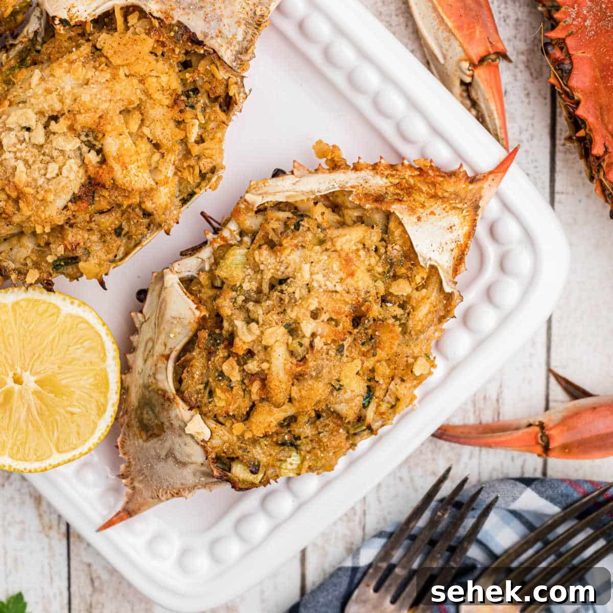 28 Delicious Sides to Serve with Jambalaya 11 Close up of a stuffed crab with some boiled crabs on the outside.