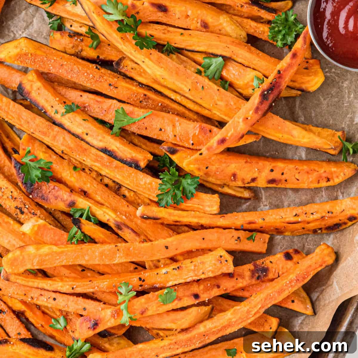 28 Delicious Sides to Serve with Jambalaya 20 Close up of some crispy sweet potatoes cropped into a square picture.