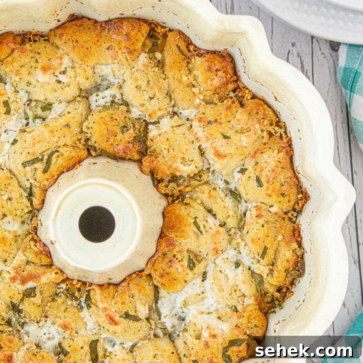 28 Delicious Sides to Serve with Jambalaya 6 Overhead close up shot of Italian monkey bread in a bundt pan - cropped square.