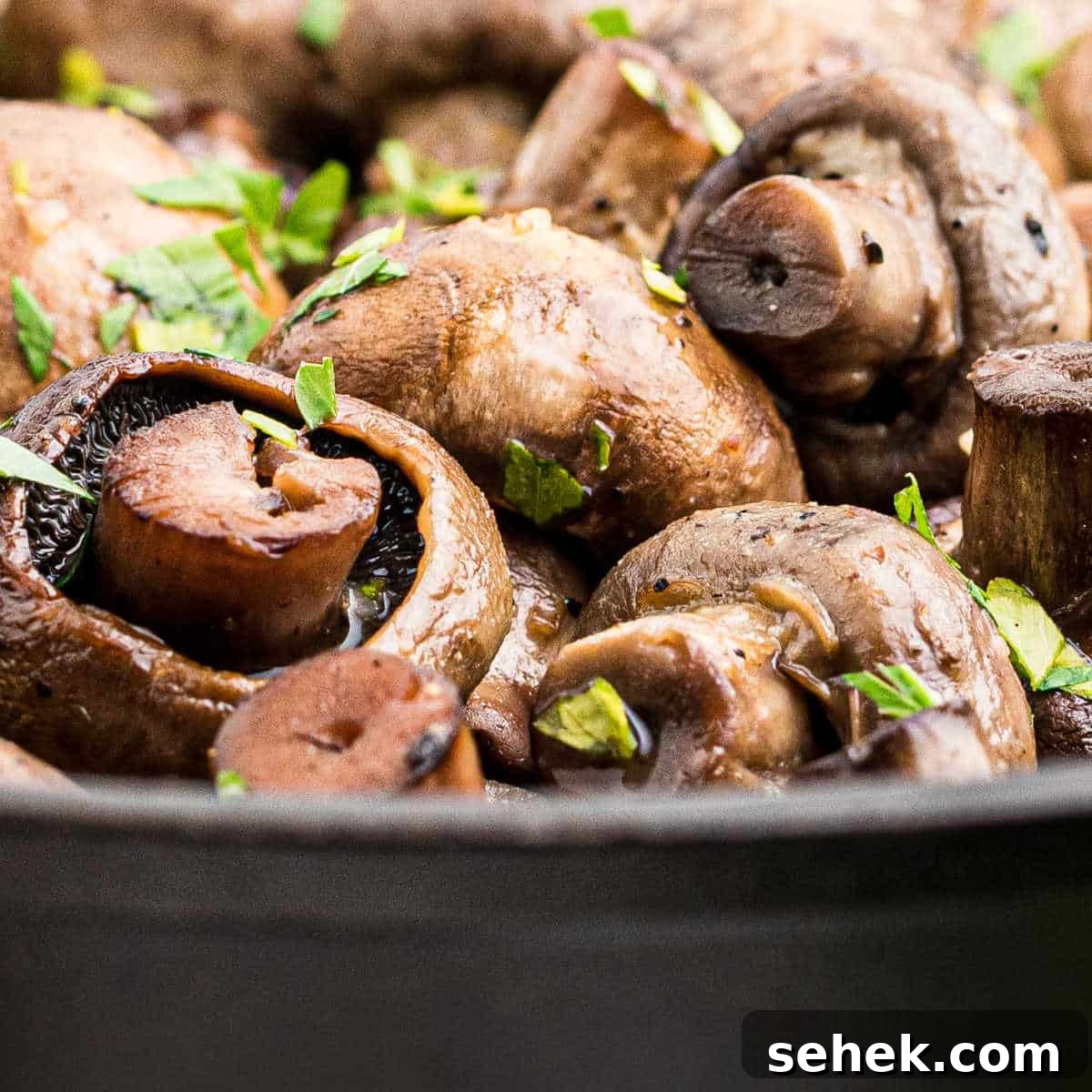 28 Delicious Sides to Serve with Jambalaya 8 close up of some smoked mushrooms in a cast iron pot.