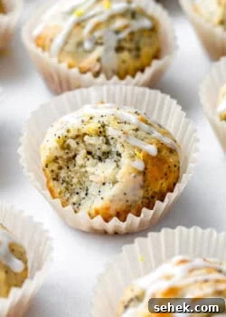 a lemon poppyseed muffin with a bite taken out of it