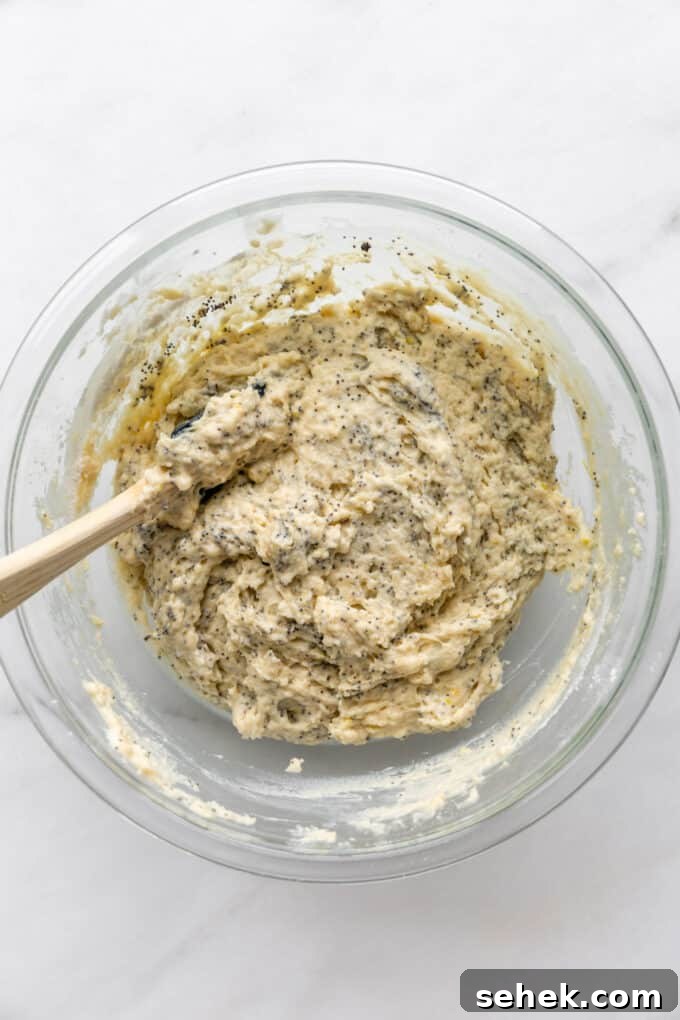 Moist Lemon Poppy Seed Muffins Recipe 8 lemon poppyseed muffin batter in a mixing bowl