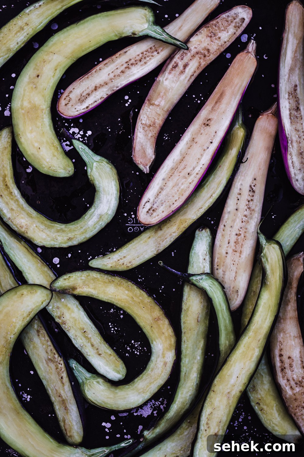 Ginger Miso Glazed Eggplant Recipe for Savory Asian Flavor 4 Japanese eggplant sliced in half lengthwise and coated with sesame oil.
