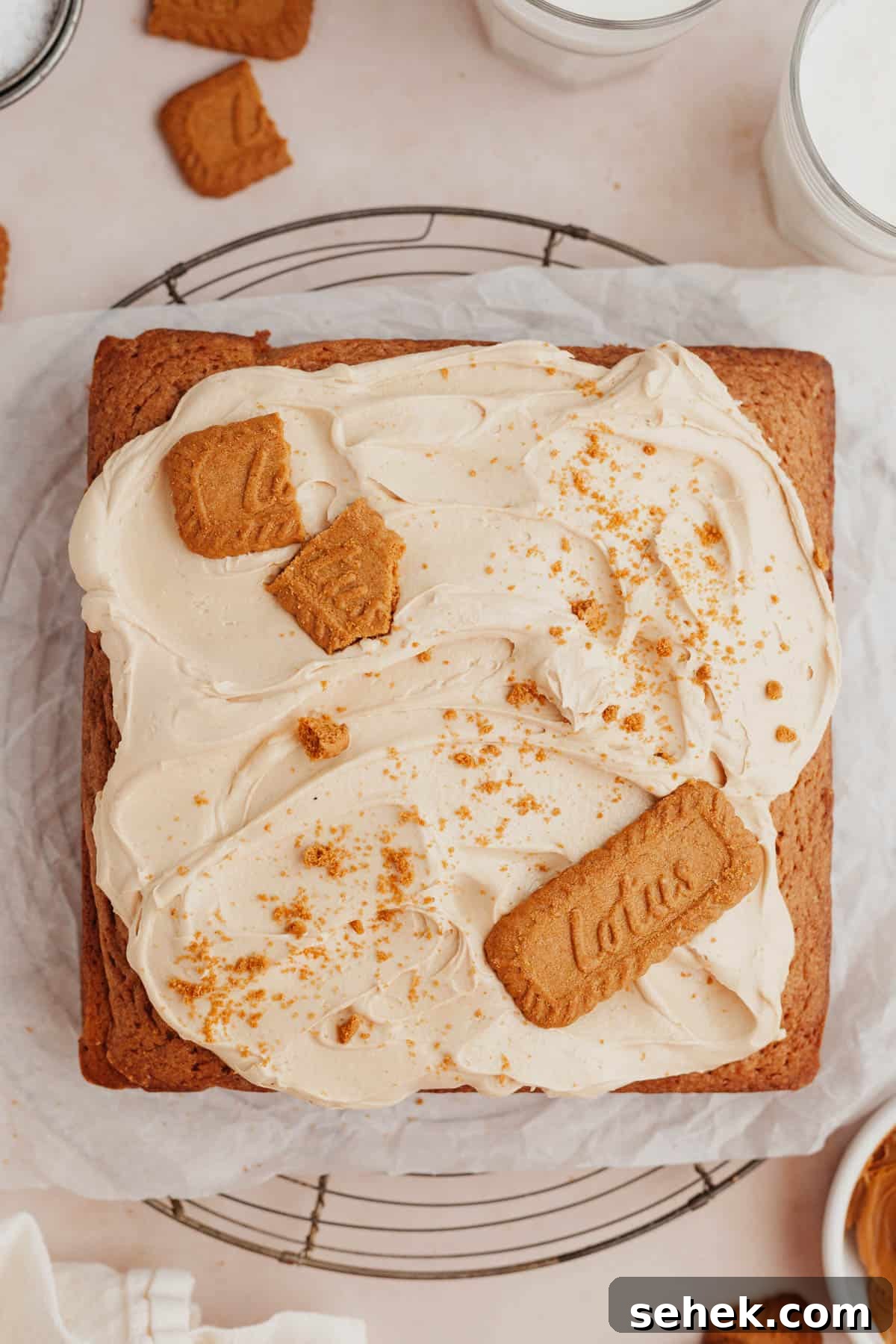 5-Ingredient Biscoff Buttercream Frosting 5 A square sheet cake covered in a beige frosting and decorated with Biscoff cookies.