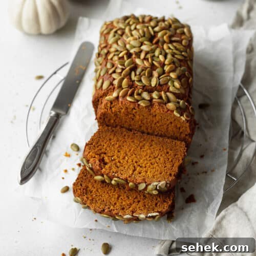 A sliced loaf of gluten free pumpkin bread.