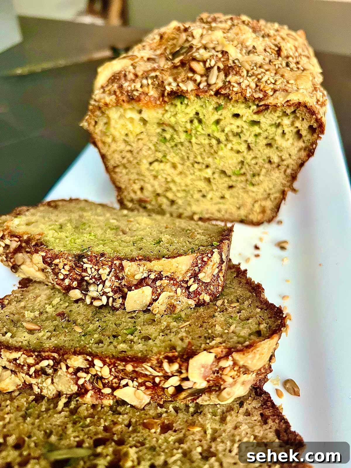 High-Protein Broccoli Bread Recipe 2 Close up of high protein broccolibread baked to perfection on a serving white ceramic rectangular plate.