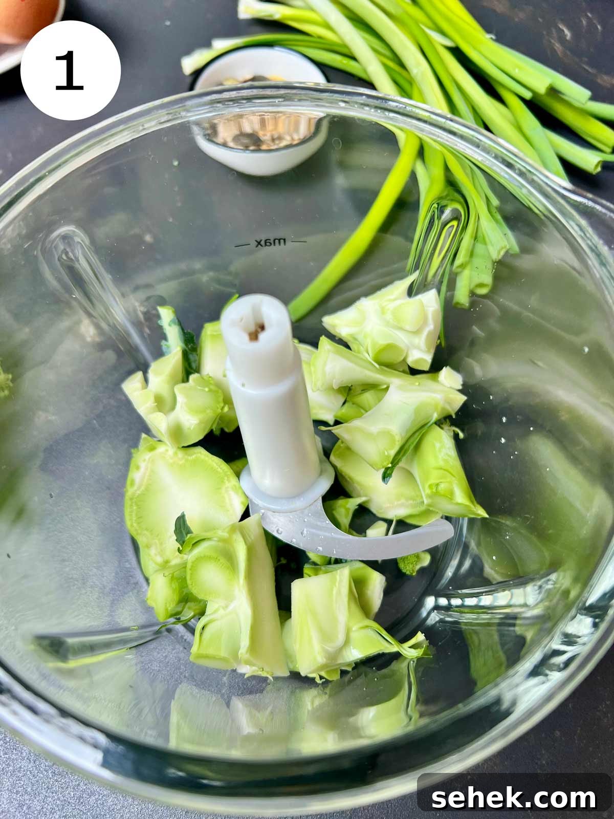 High-Protein Broccoli Bread Recipe 4 Broccoli stalks in a glass bowled blender.