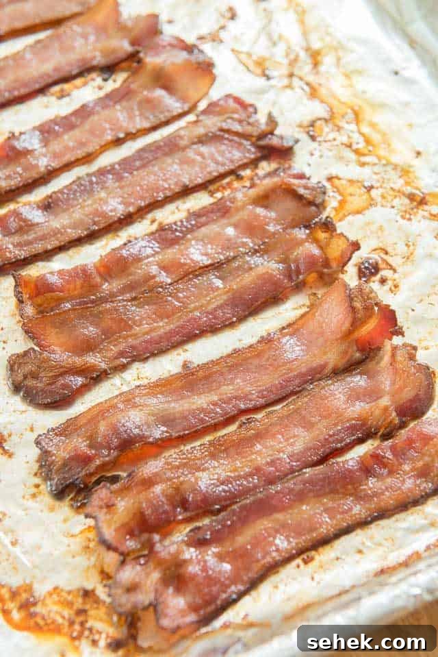 Crispy Oven Bacon: How to Bake Bacon for Even Crispness 3 Oven Cooked Bacon Strips on Sheet Pan