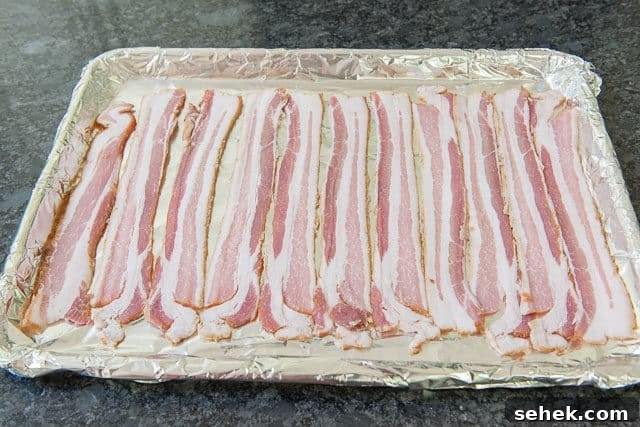 Crispy Oven Bacon: How to Bake Bacon for Even Crispness 5 Bacon Strips Laid Down on Sheet Pan Evenly