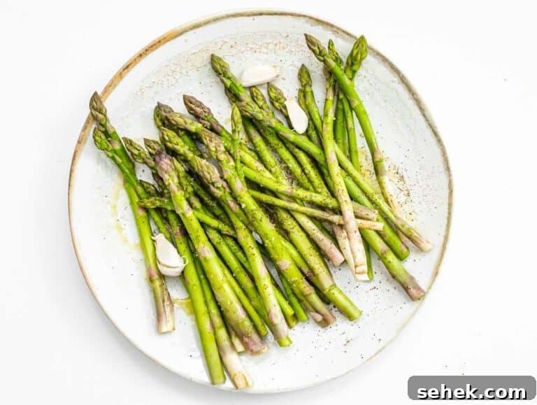 How to Cook Asparagus: Roasting, Sautéing and Steaming Tips 12 tossing asparagus in oil, salt, and pepper