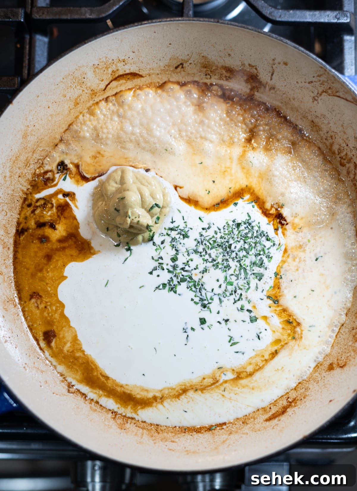 Skillet Chicken with Creamy Mustard Sauce 9 Mustard cream sauce ingredients in a skillet.