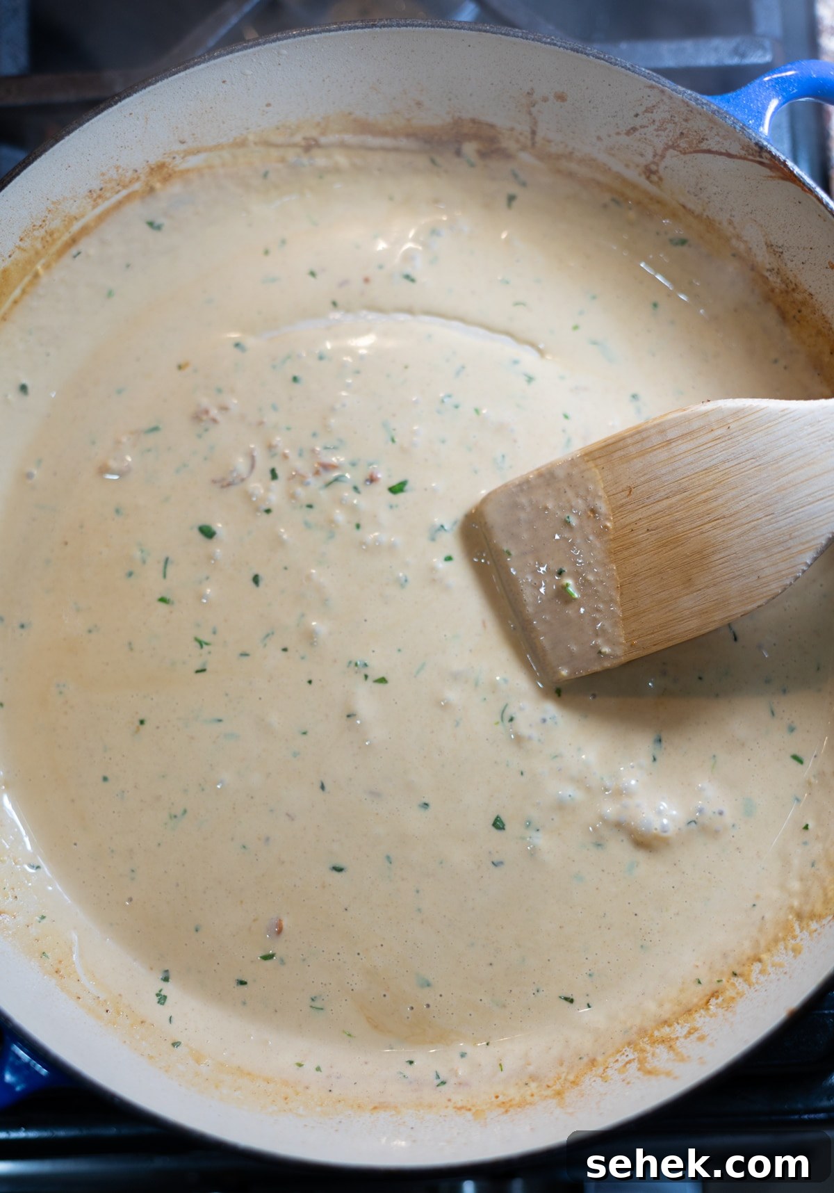 Skillet Chicken with Creamy Mustard Sauce 10 Person making a sauce in a skillet.