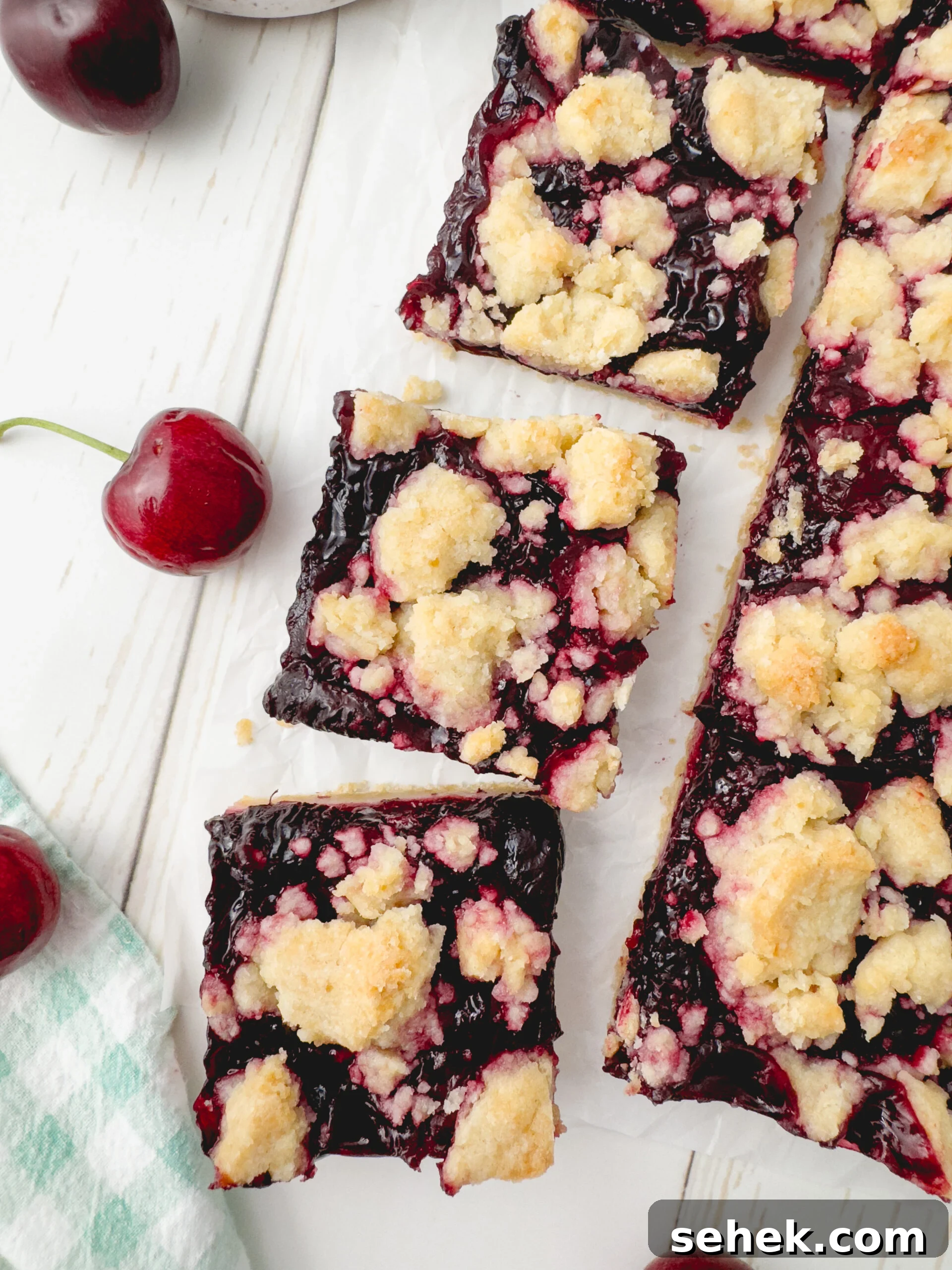 Cherry Crumb Bars with Buttery Streusel 2 Cherry crumb bars on a cutting board