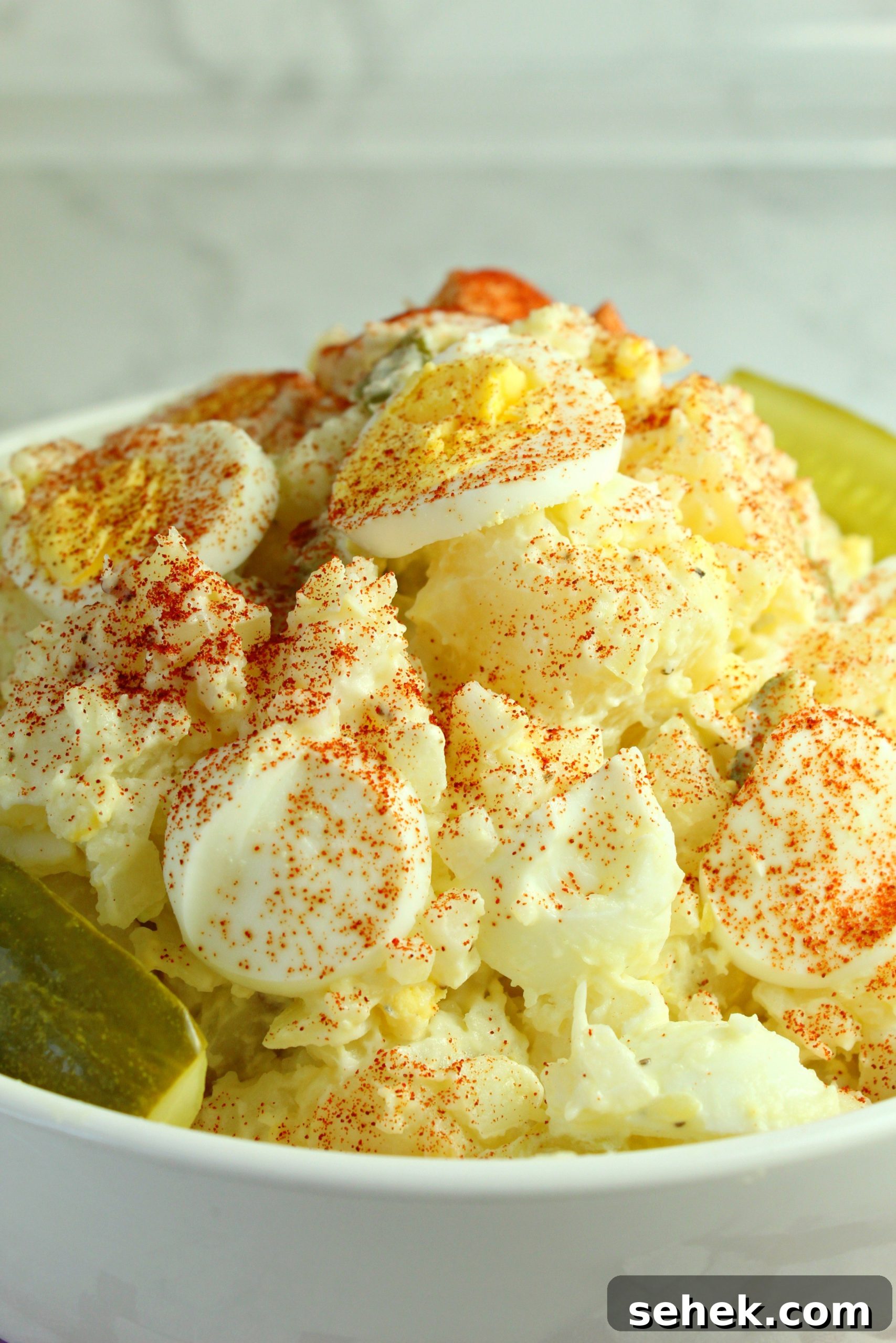 Tangy Dill Pickle Potato and Egg Salad 4 Close-up of egg slices on salad